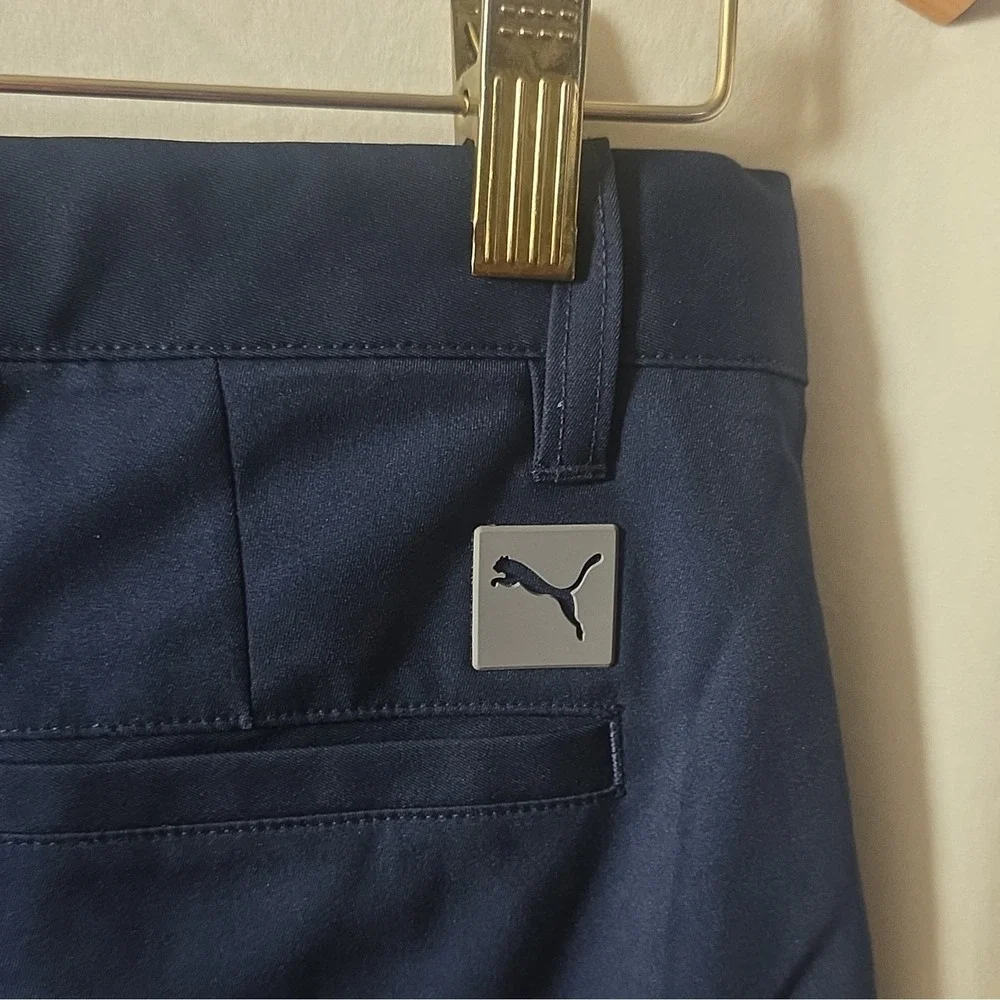 Puma youth boys navy performance shorts. Size large (13-14Y), made in Vietnam.